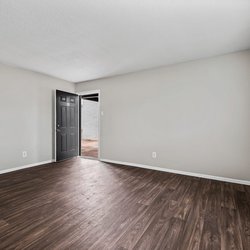 wood floor living room at the Oakley apartment homes in Tuscaloosa, AL