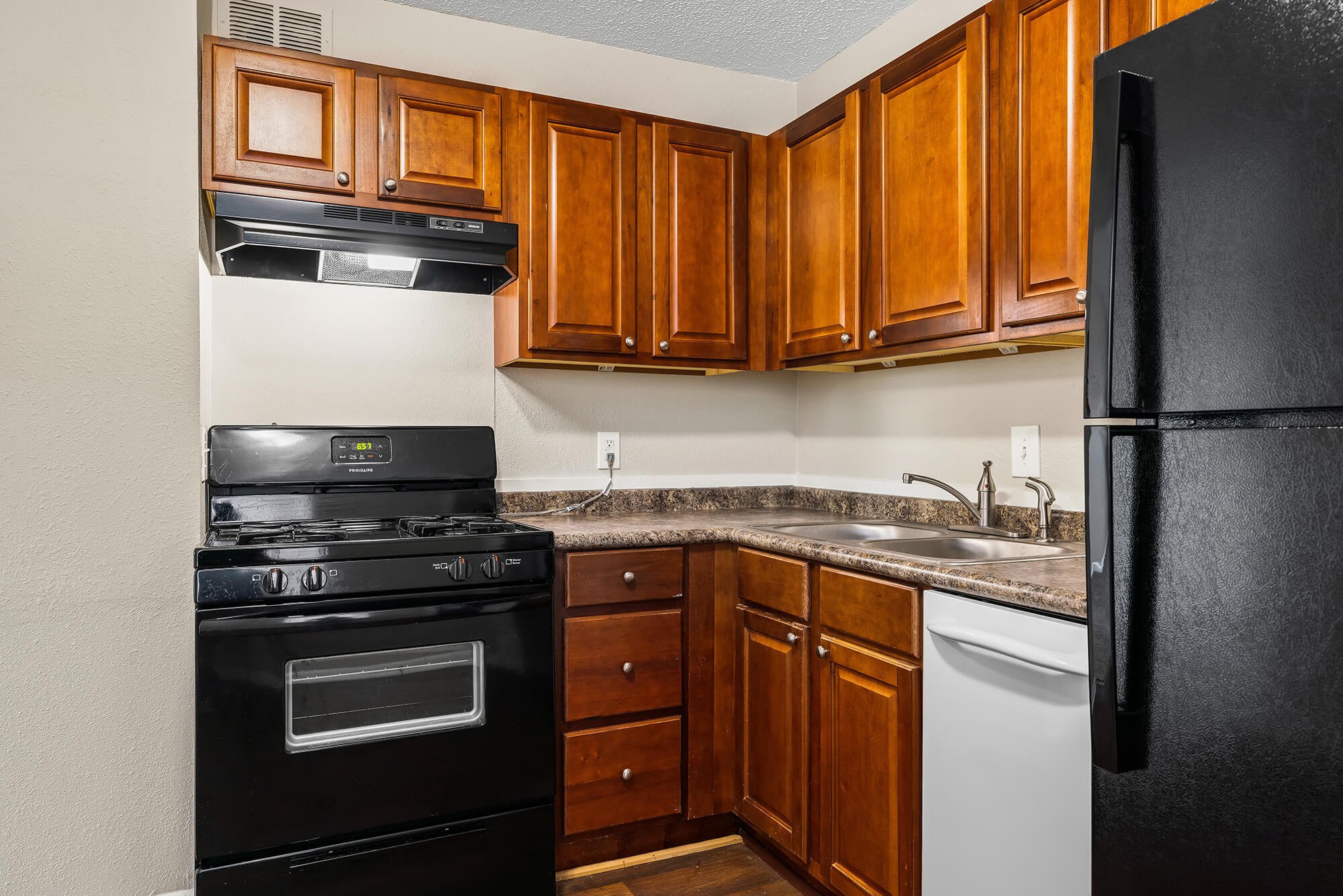 wood cabinets in kitchen at the Oakley apartment homes in Tuscaloosa, AL